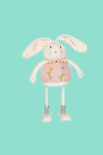 Felt Easter bunny standing figure with green background.