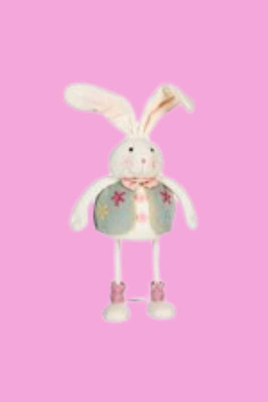 Felt Easter bunny standing figure with pink background.