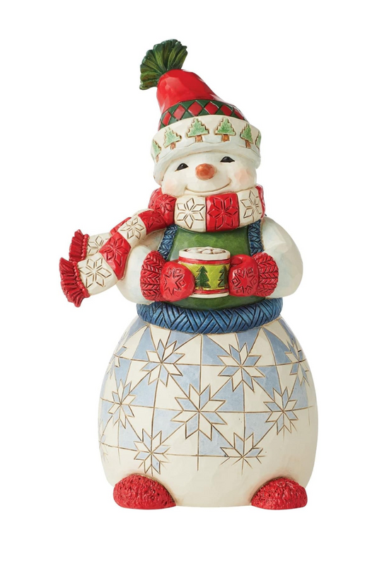 A Christmas snowman figure holding a cup of hot chocolate.
