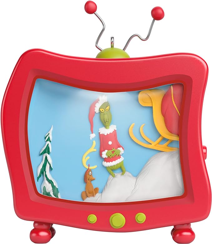 A Christmas ornament of a red, vintage TV set that is wavy and distorted and depicts a scene from the animated movie "How the Grinch Stole Christmas". 