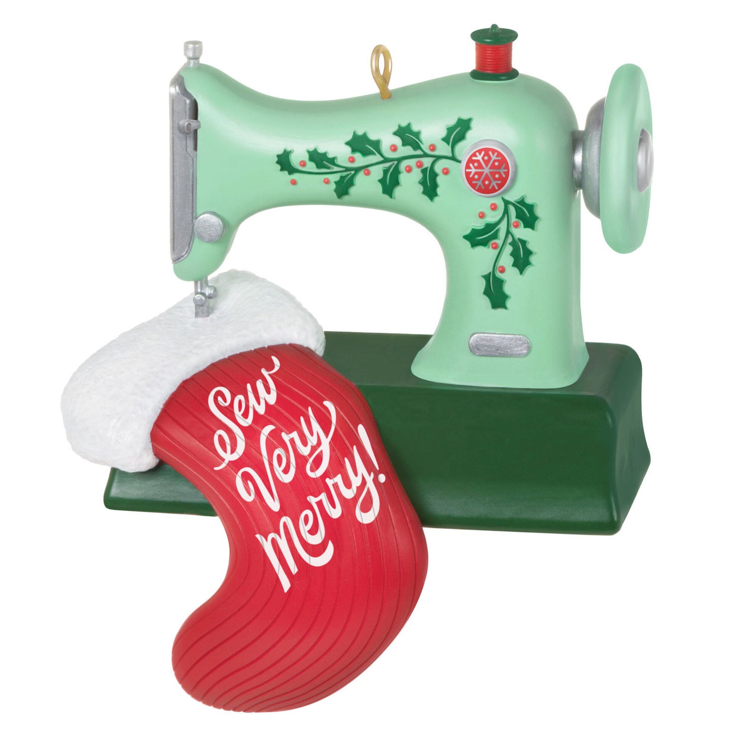 Christmas ornament depicting a green sewing machine with holly embellishments, sewing a red stocking with the words "Sew Very Merry!" sewn in white letters. 