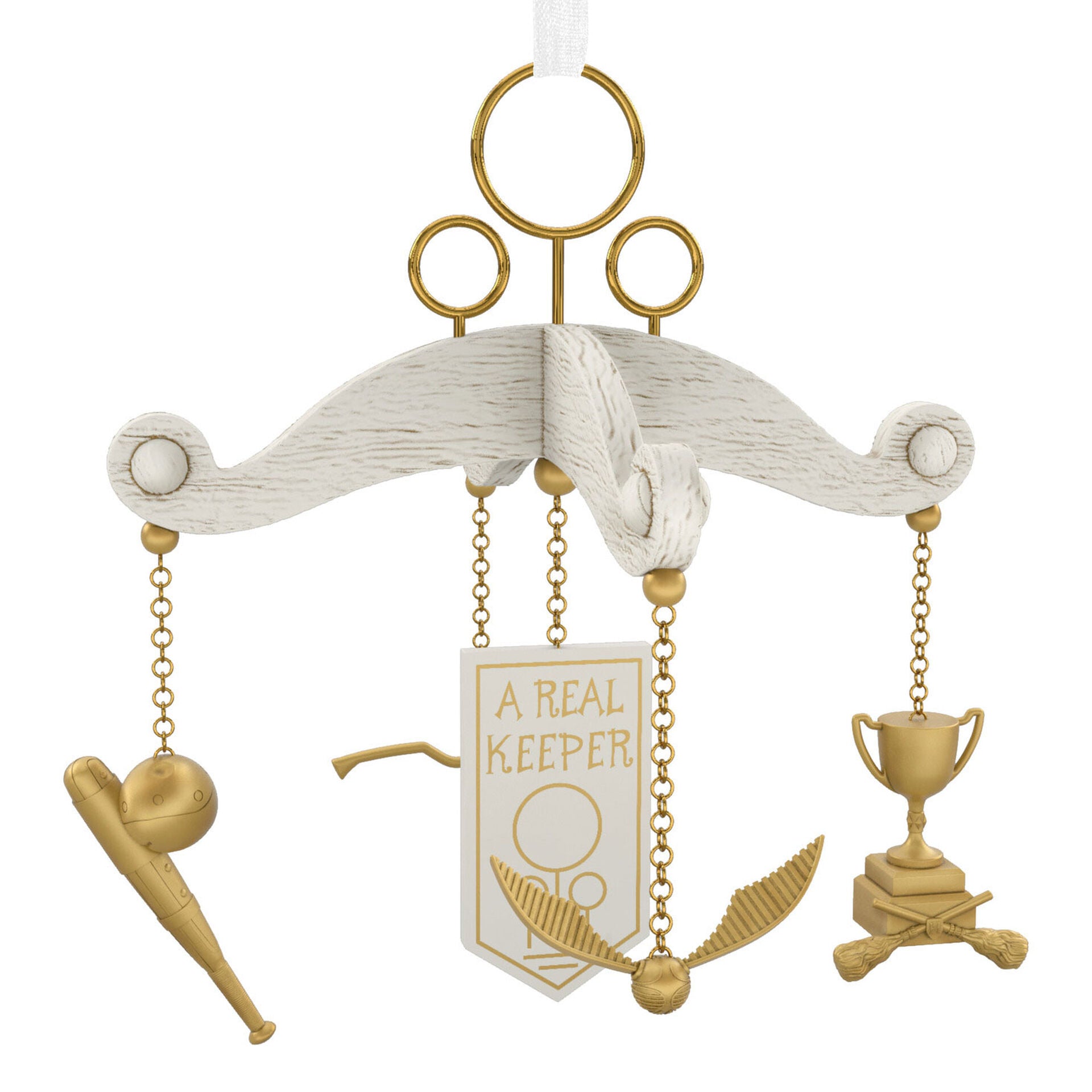 A Christmas ornament that is a white and gold Harry Potter Quidditch themed baby mobile. The center is a banner that says "A Real Keeper" and is surrounded by four Quidditch gear figures.