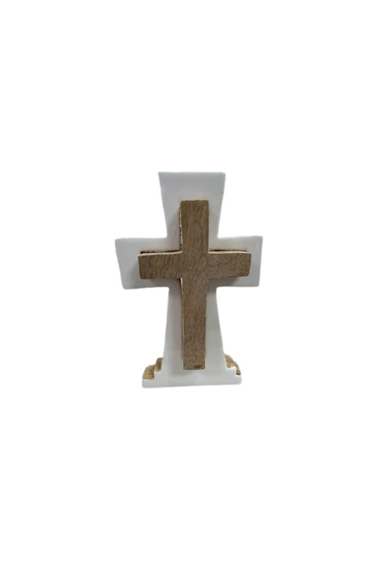 A white wooden cross figure with a smaller brown wooden cross in the center.