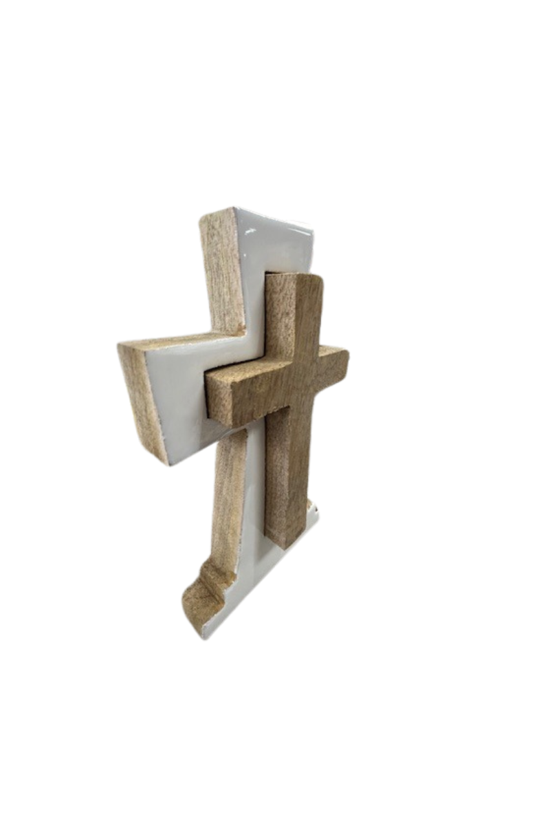 A white wooden cross figure with a smaller brown wooden cross in the center.