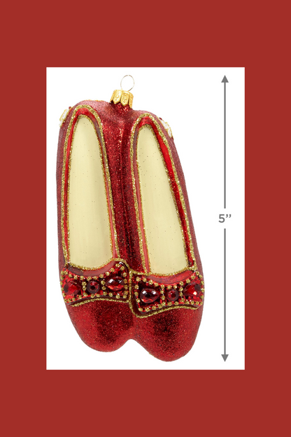 An ornament of the red shoes from The Wizard of Oz with arrows on the side showing that the height of the ornament is 5 inches.