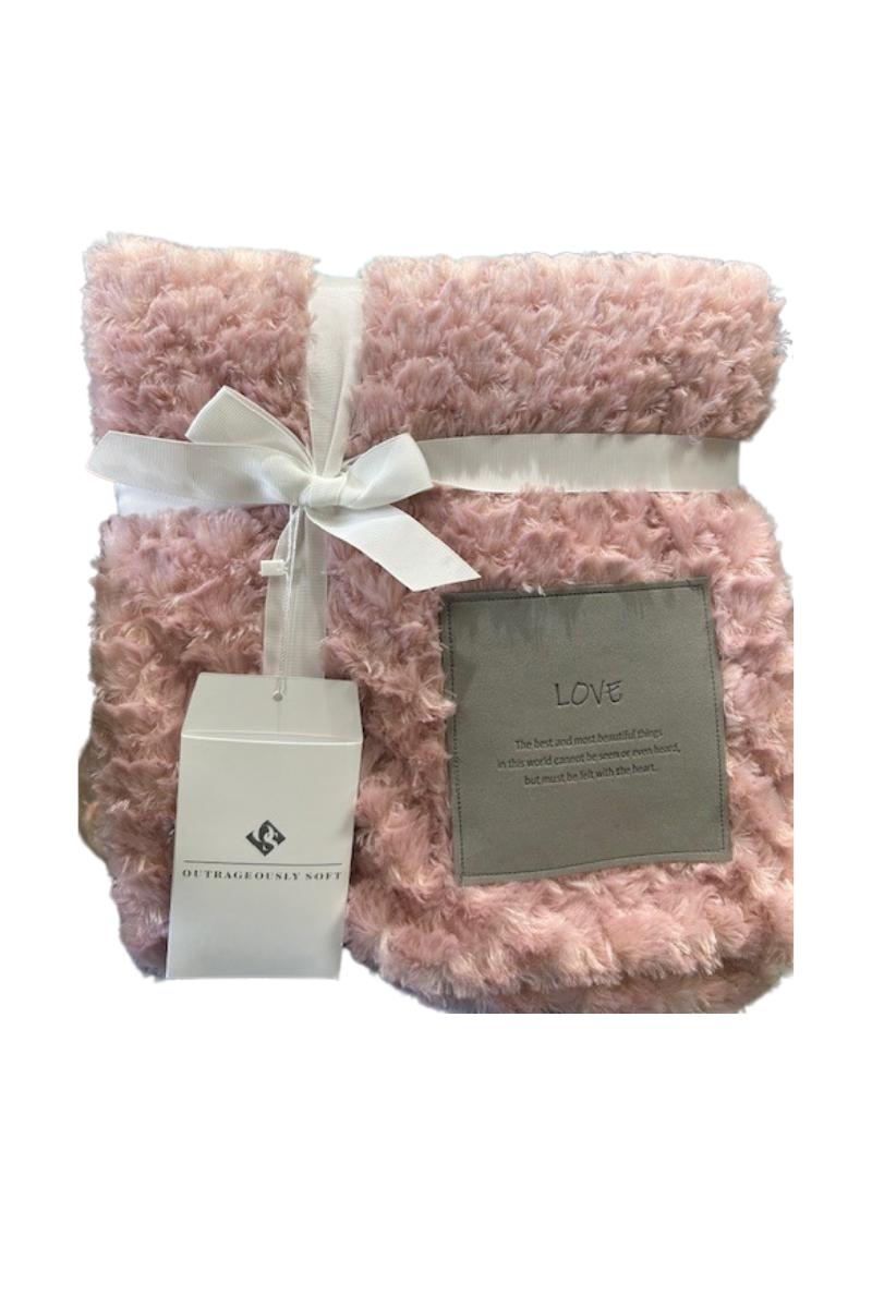 A fuzzy pink blanket with a grey patch that can be personalized.