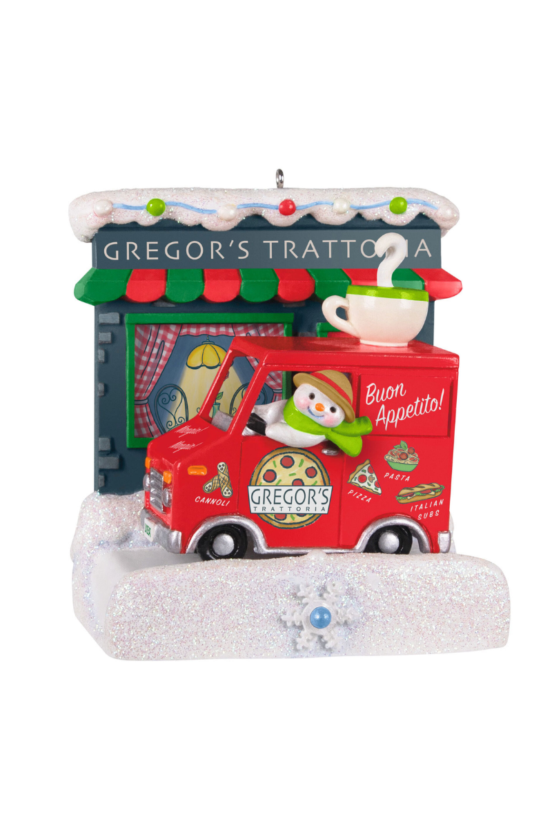 Christmas ornament depicting a snowman driving a food truck in front of "Gregor's Trattoria".