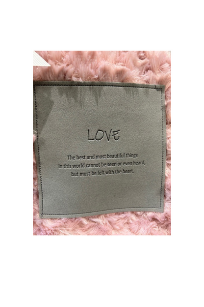 An enlarged view of a patch on a blanket that can be personalized.