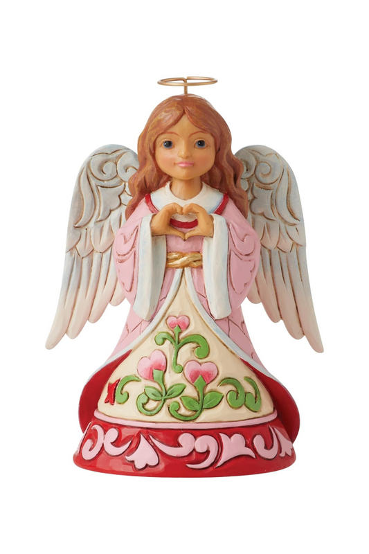 A figurine of an angel with light skin and brown hair. Her robe is pink, white, and red with floral designs.