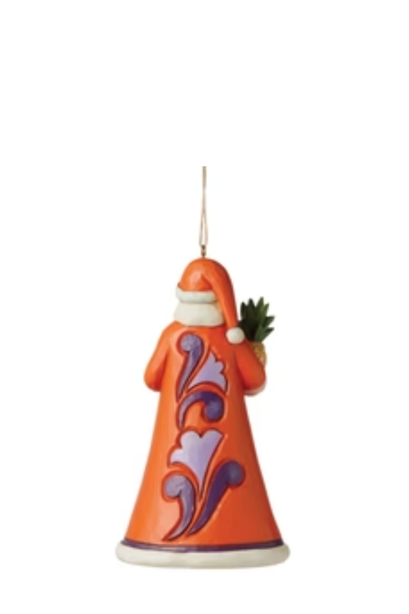The back of a Santa ornament with purple floral embellishments.